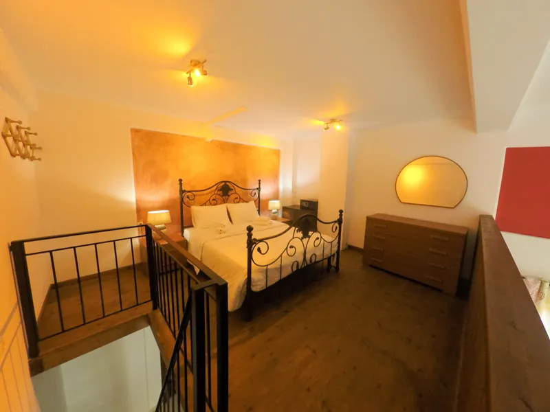 A bedroom in the split-level apartment