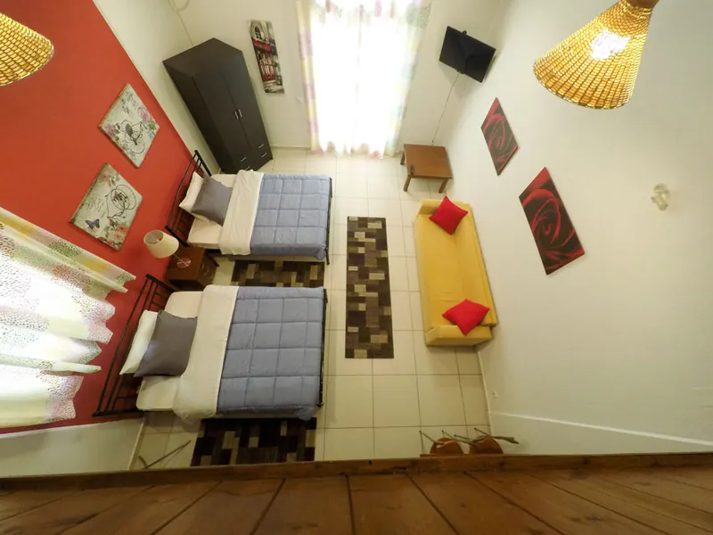 The sofa and dining table on the lower level