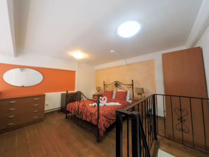 The bed on the upper level