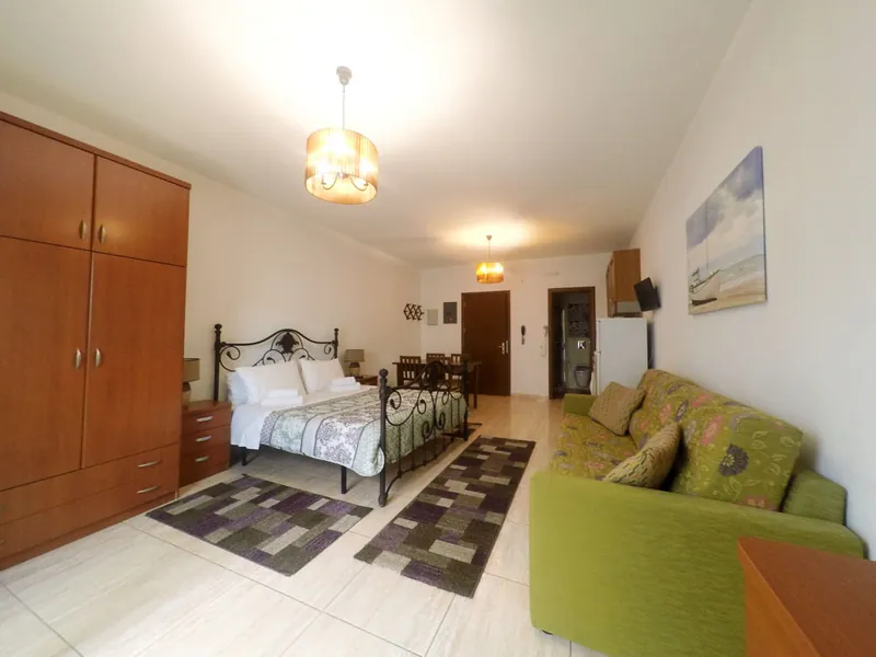 The studio, with its bed and sitting area